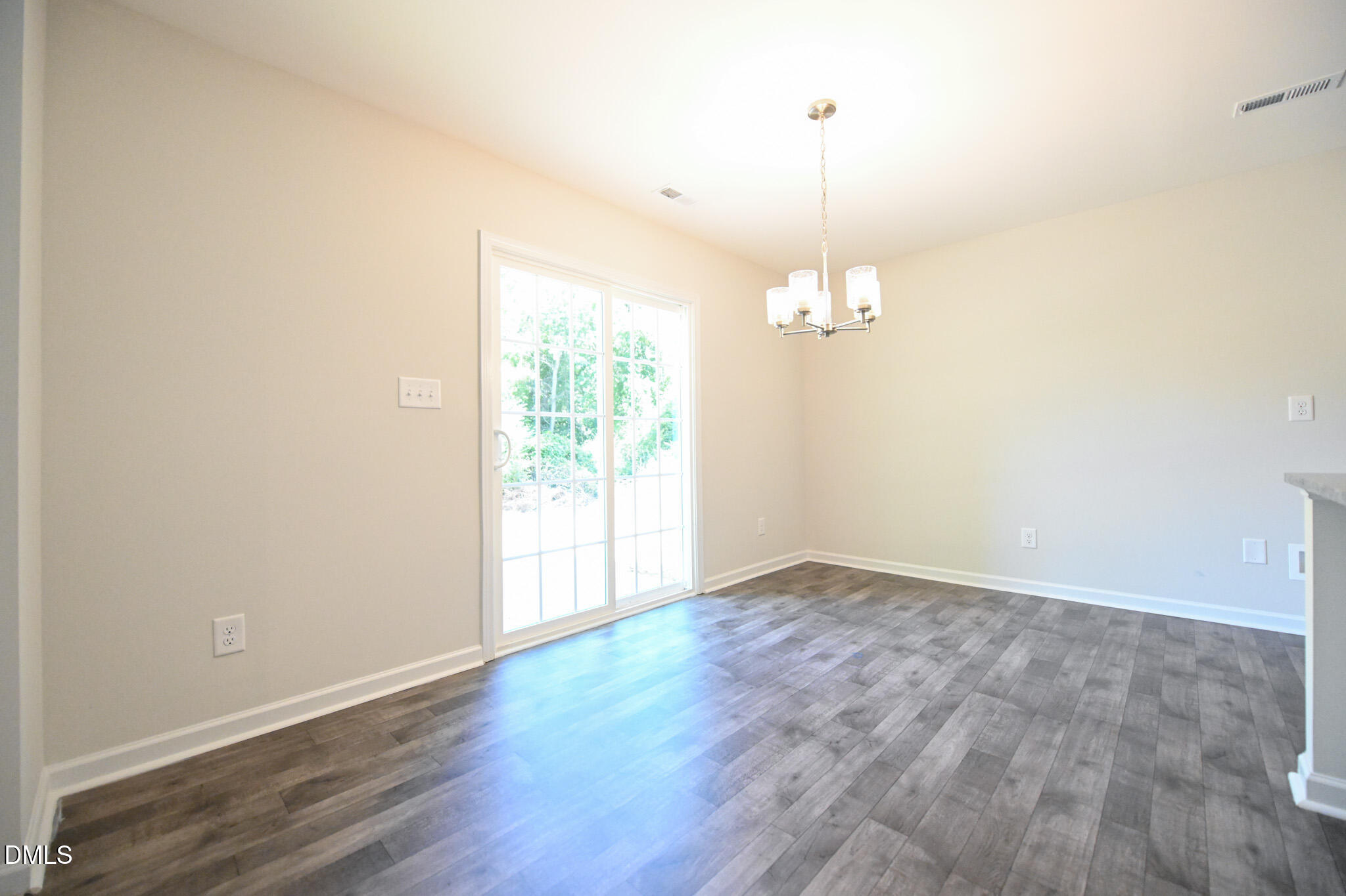 2009 Black Bear Court, Unit (LOT 5) Hope Mills, NC 28348 - Photo 10 of 29 an empty room with wooden floor and windows