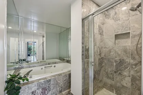 a bathroom with a bathtub and a sink