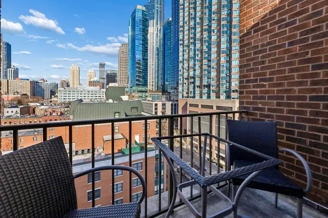 a view of a balcony with chairs