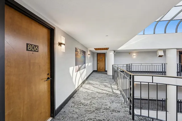 a view of a hallway with stairs