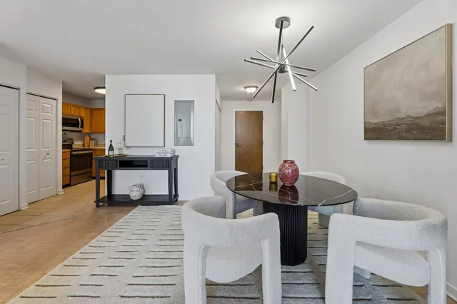 a living room with furniture a dining table and chairs
