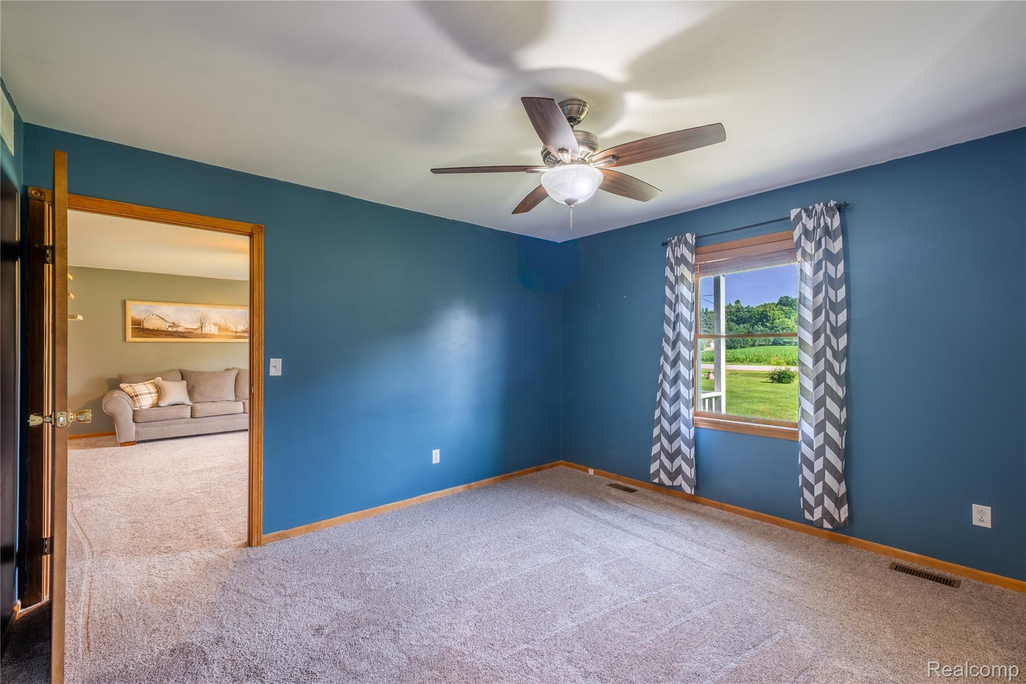 9600 Hamill Road Otisville, MI 48463 - Photo 14 of 32 Carpeted room with blue painted walls and white trim