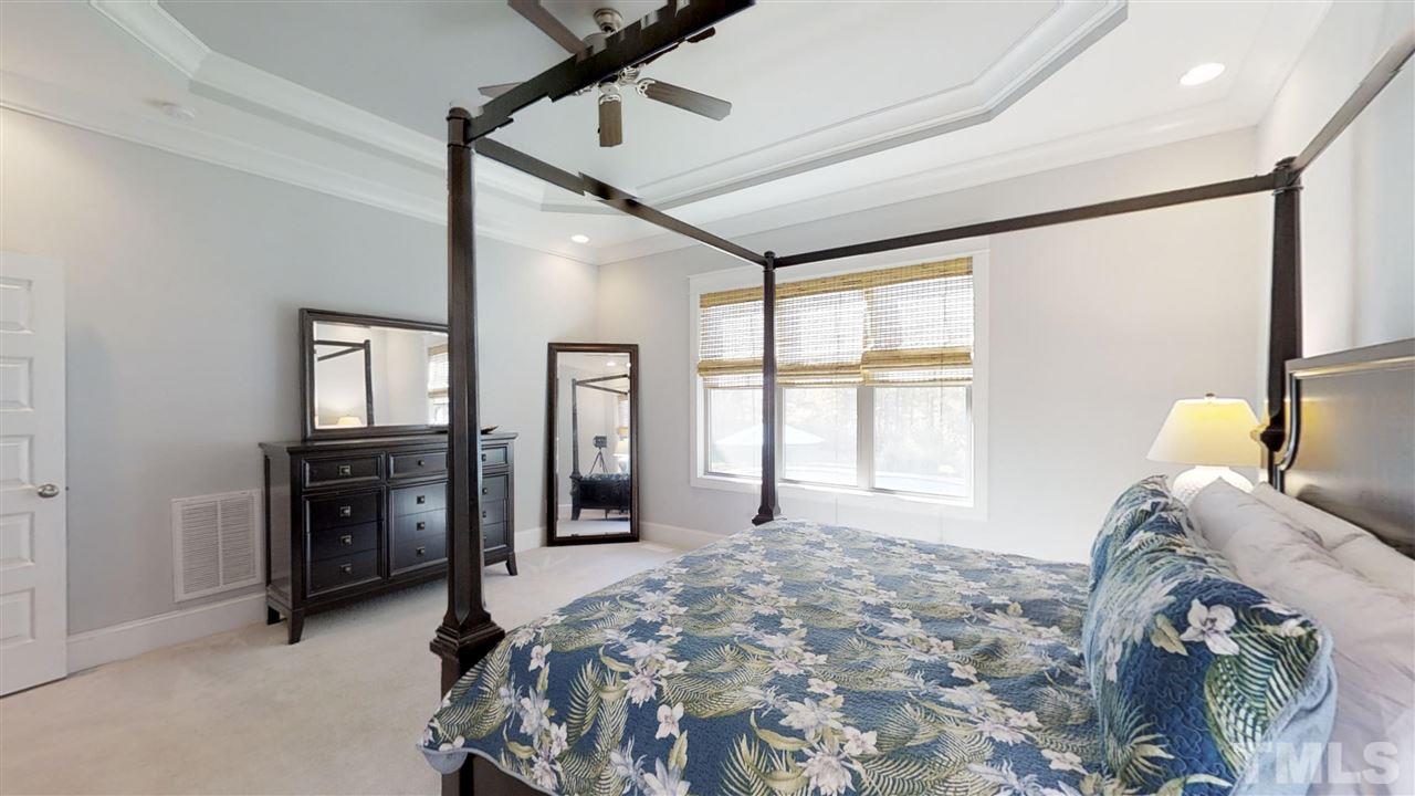3128 Constance Circle Raleigh, NC 27603 - Photo 15 of 25 a bedroom with a bed and a window