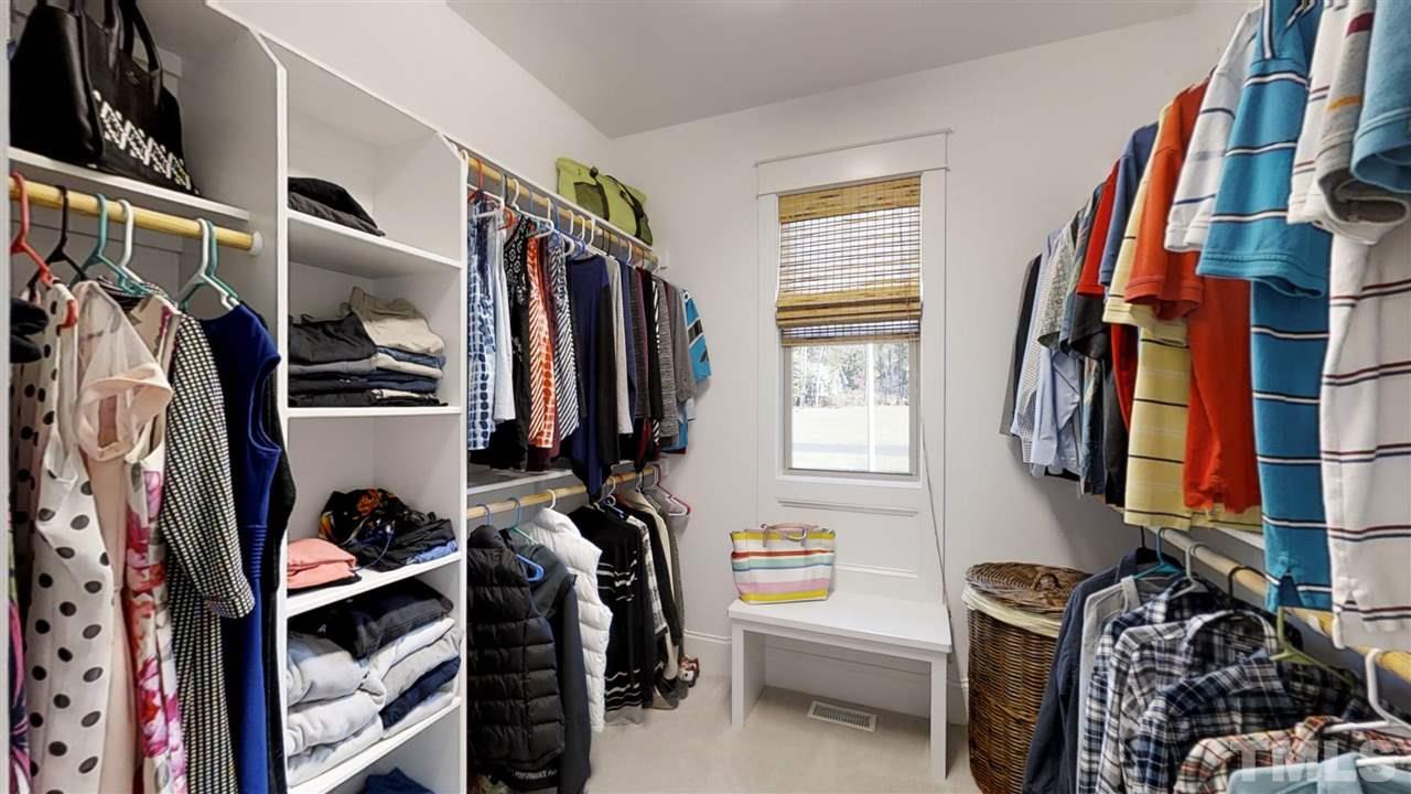 3128 Constance Circle Raleigh, NC 27603 - Photo 18 of 25 a view of walk in closet with clothes and shoes