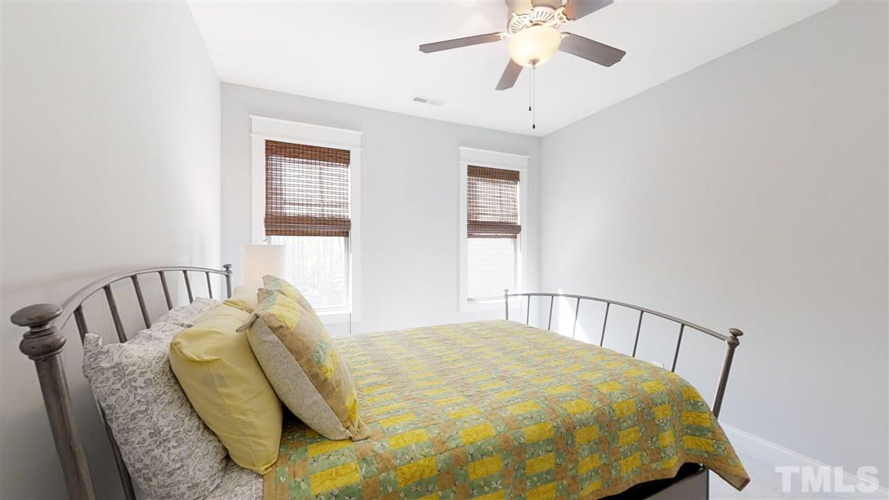3128 Constance Circle Raleigh, NC 27603 - Photo 19 of 25 a bed sitting in a bedroom next to a window