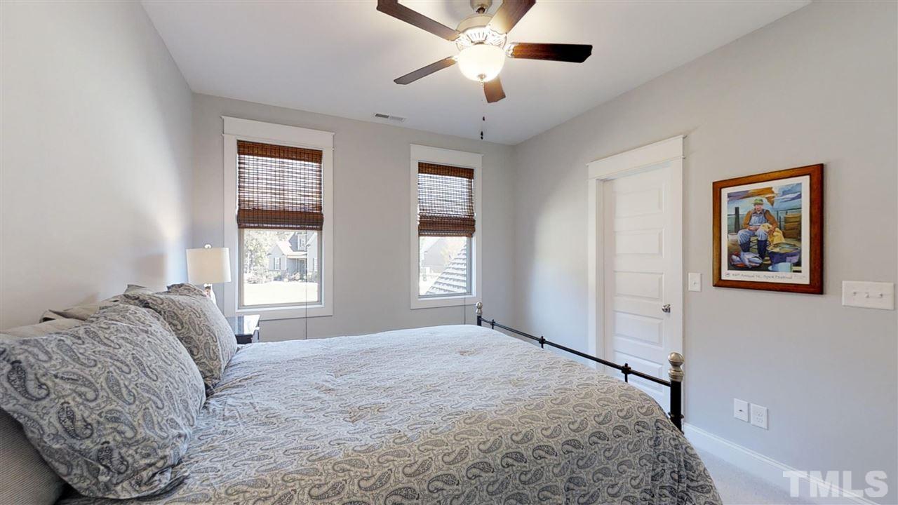 3128 Constance Circle Raleigh, NC 27603 - Photo 22 of 25 a bedroom with a bed and a window