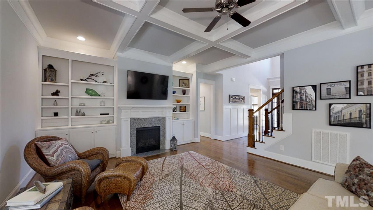 3128 Constance Circle Raleigh, NC 27603 - Photo 5 of 25 a living room with furniture a flat screen tv and a fireplace