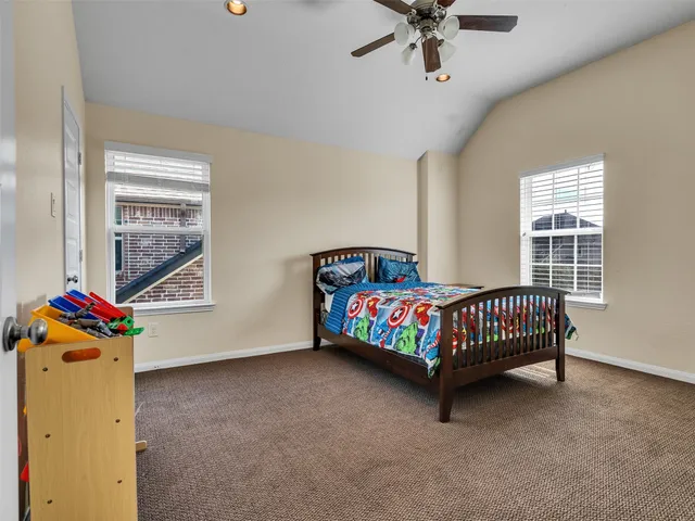 a bedroom with a bed and window