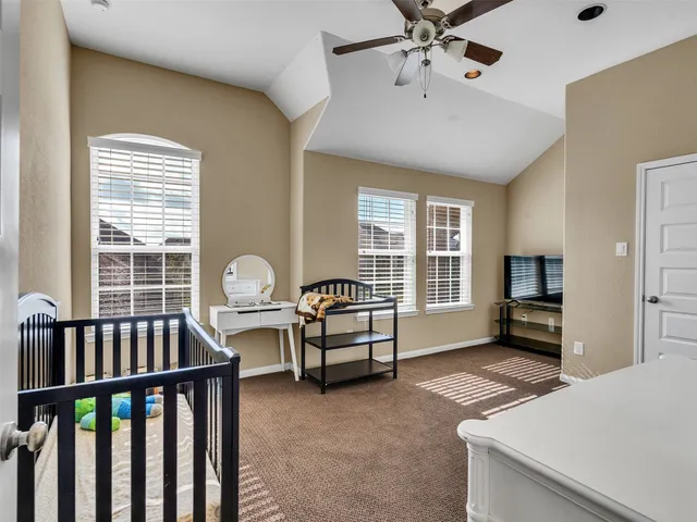 a bedroom with furniture and a window