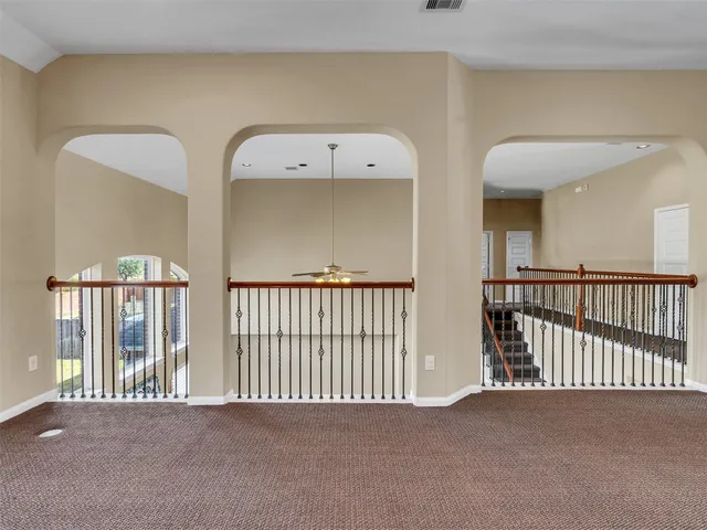 a view of a hallway with entryway