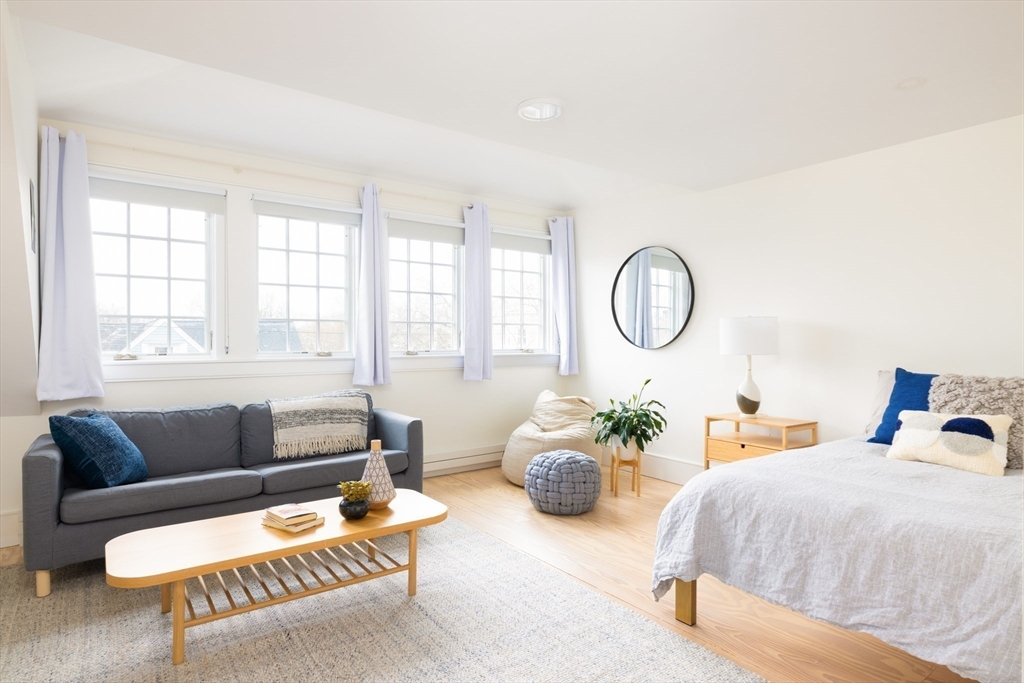 102 Fuller Street, Unit 2 Brookline, MA 02446 - Photo 11 of 27 a bedroom with furniture and a large window