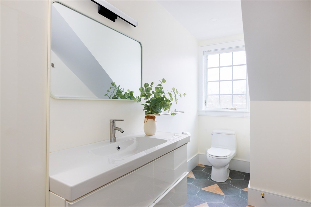 102 Fuller Street, Unit 2 Brookline, MA 02446 - Photo 17 of 27 a bathroom with a sink toilet and window