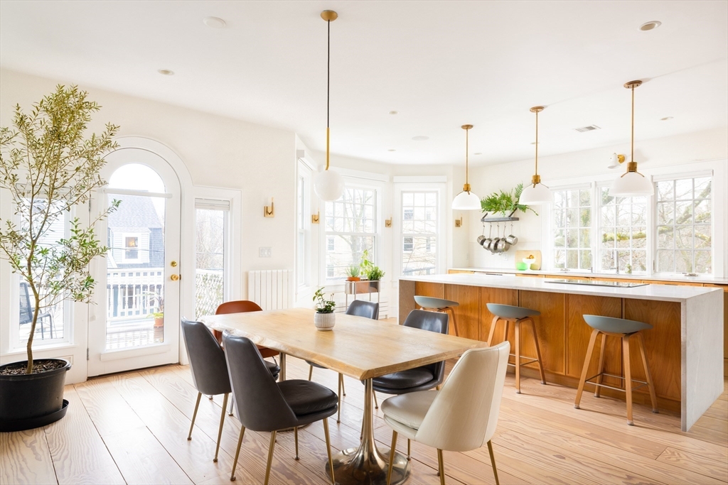 102 Fuller Street, Unit 2 Brookline, MA 02446 - Photo 6 of 27 a dining room with furniture and wooden floor