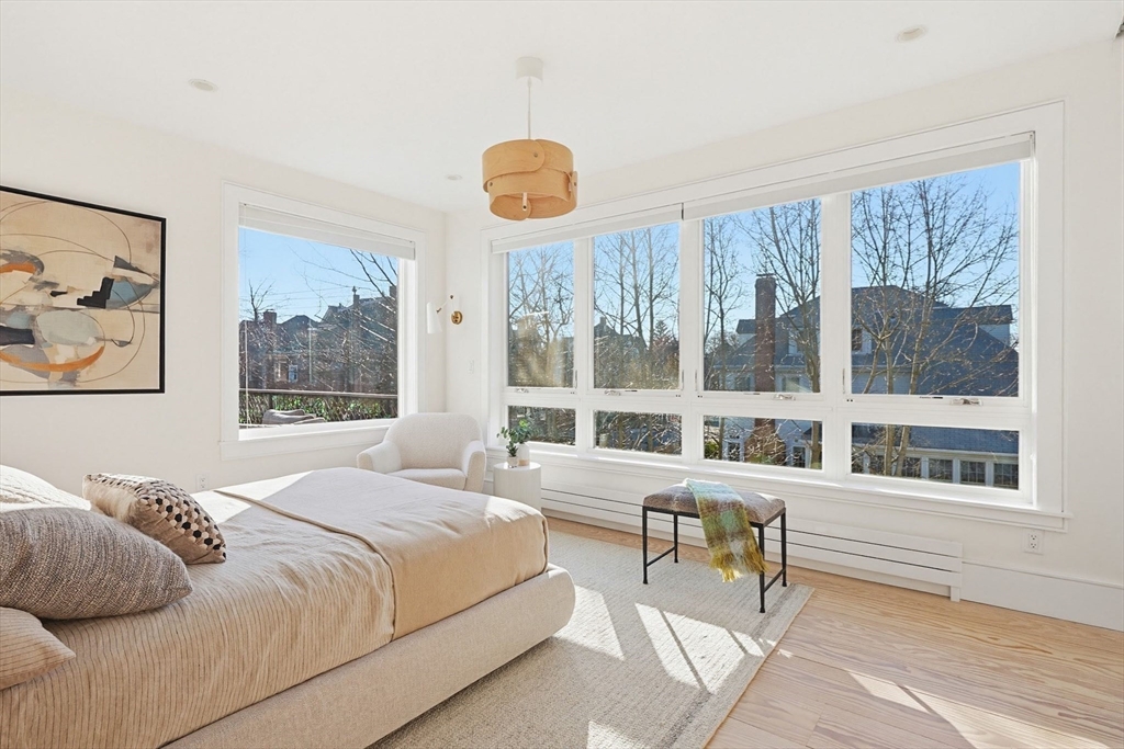 102 Fuller Street, Unit 2 Brookline, MA 02446 - Photo 8 of 27 a bedroom with a bed and a large window
