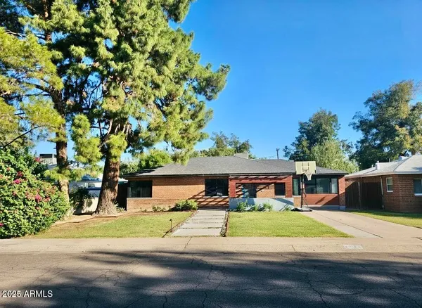 front view of a house with a yard