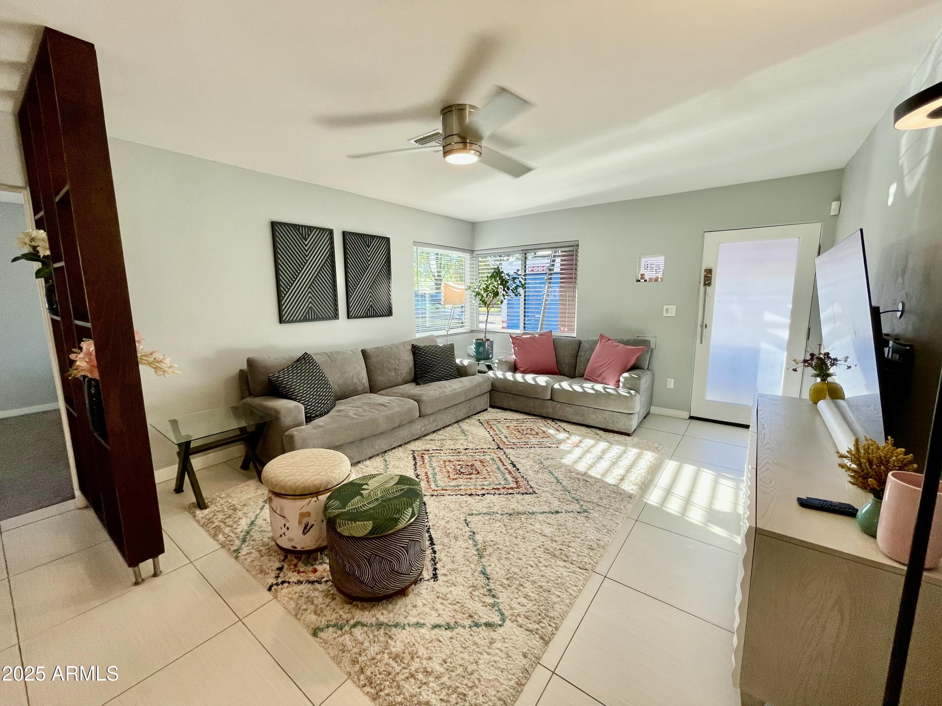 1520 West Berridge Lane Phoenix, AZ 85015 - Photo 11 of 46 a living room with furniture and a flat screen tv