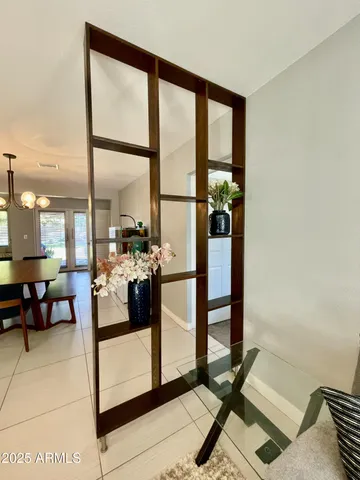 a view of living room with furniture and floor to ceiling window
