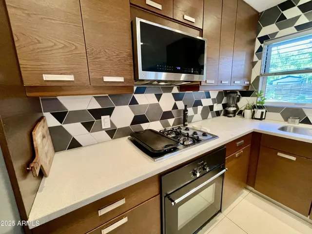 a kitchen with a stove and a microwave