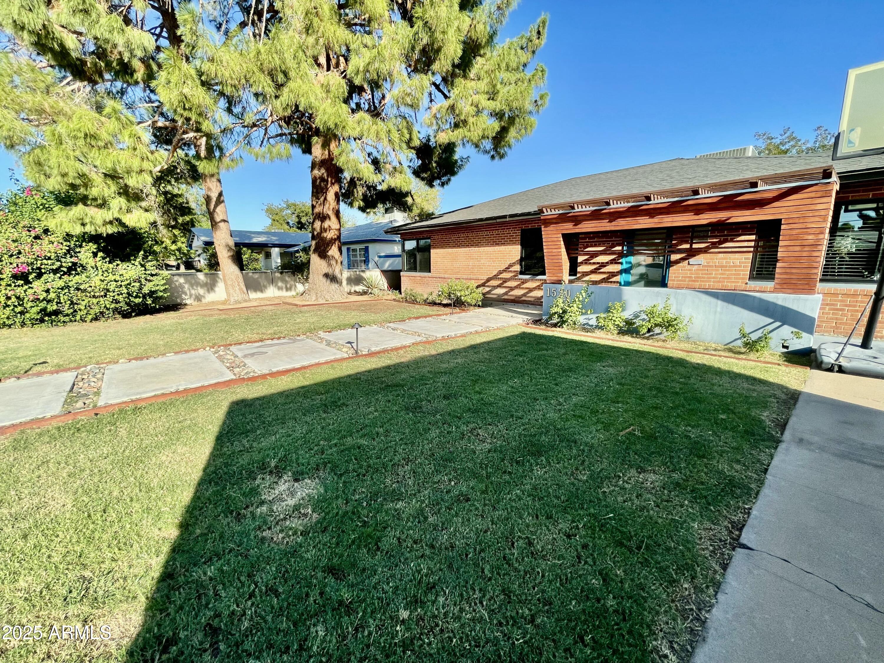 1520 West Berridge Lane Phoenix, AZ 85015 - Photo 3 of 46 a view of a back yard of the house
