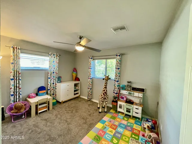 a bed room with furniture and a window