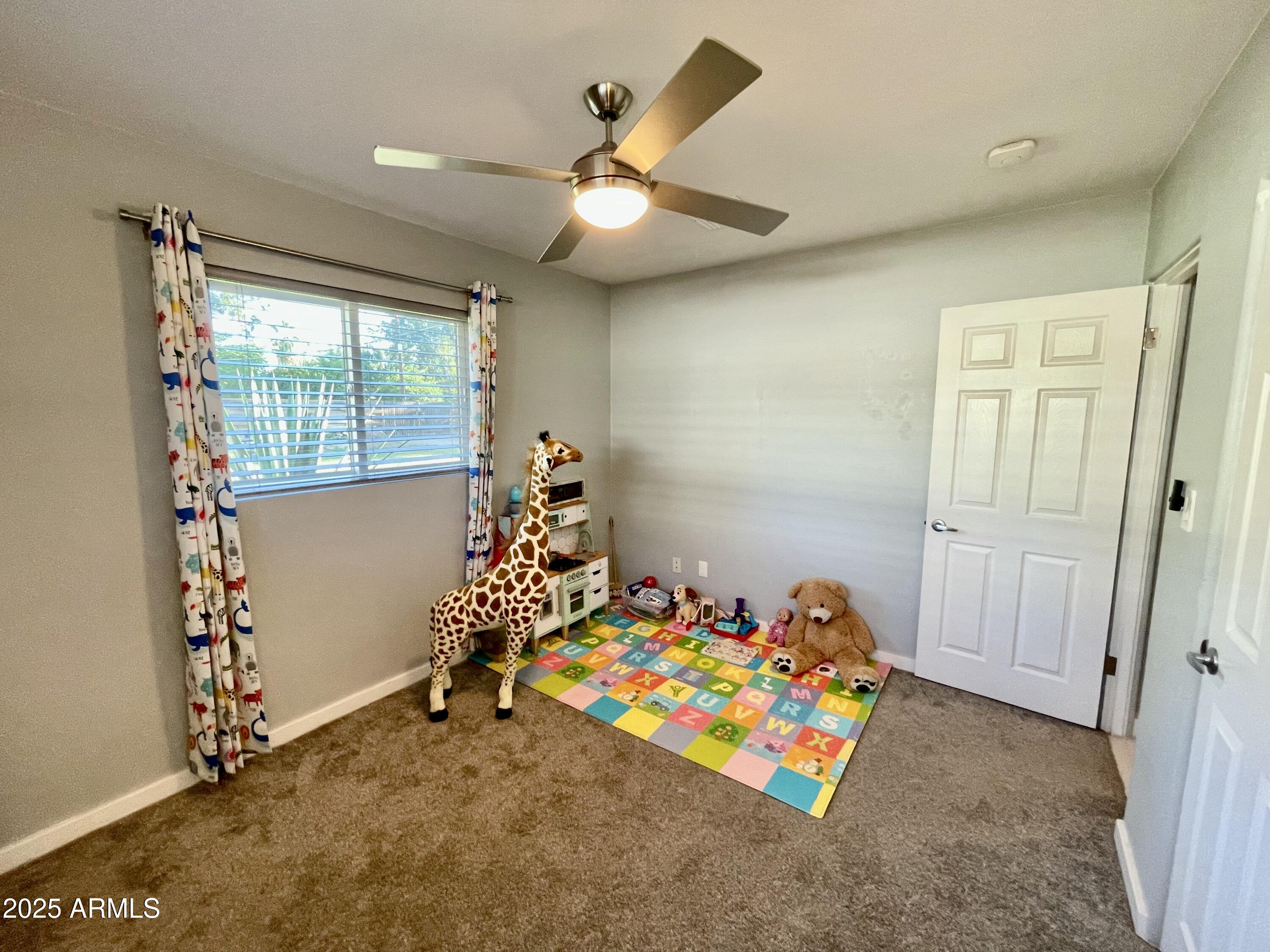 1520 West Berridge Lane Phoenix, AZ 85015 - Photo 34 of 46 a bedroom with bed and a window