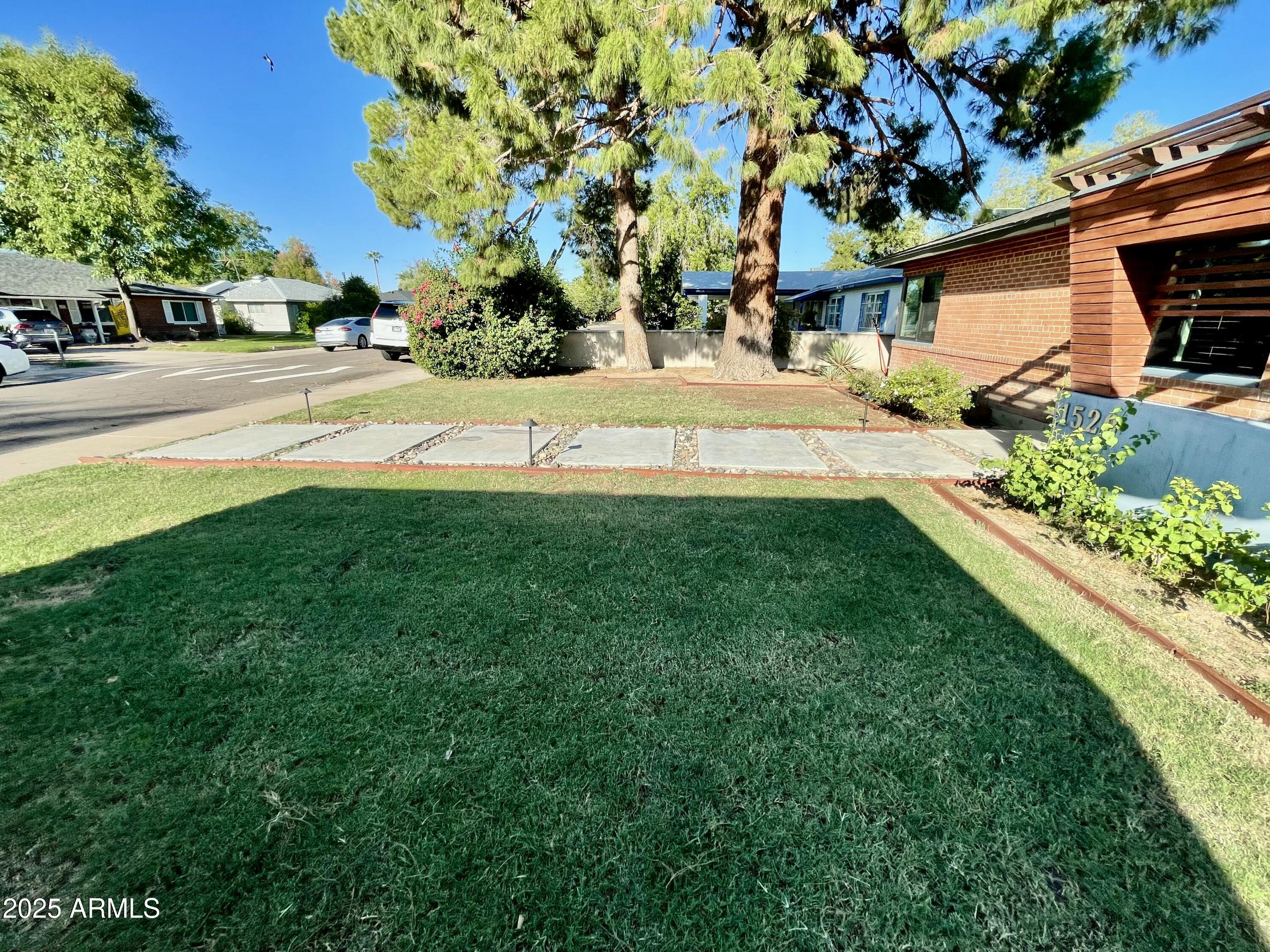 1520 West Berridge Lane Phoenix, AZ 85015 - Photo 4 of 46 a swimming pool with barbeque oven in front of it