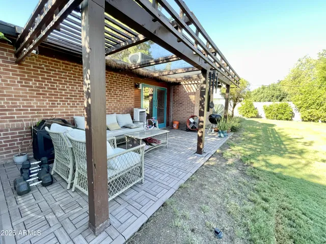 a view of a chairs and table in the patio