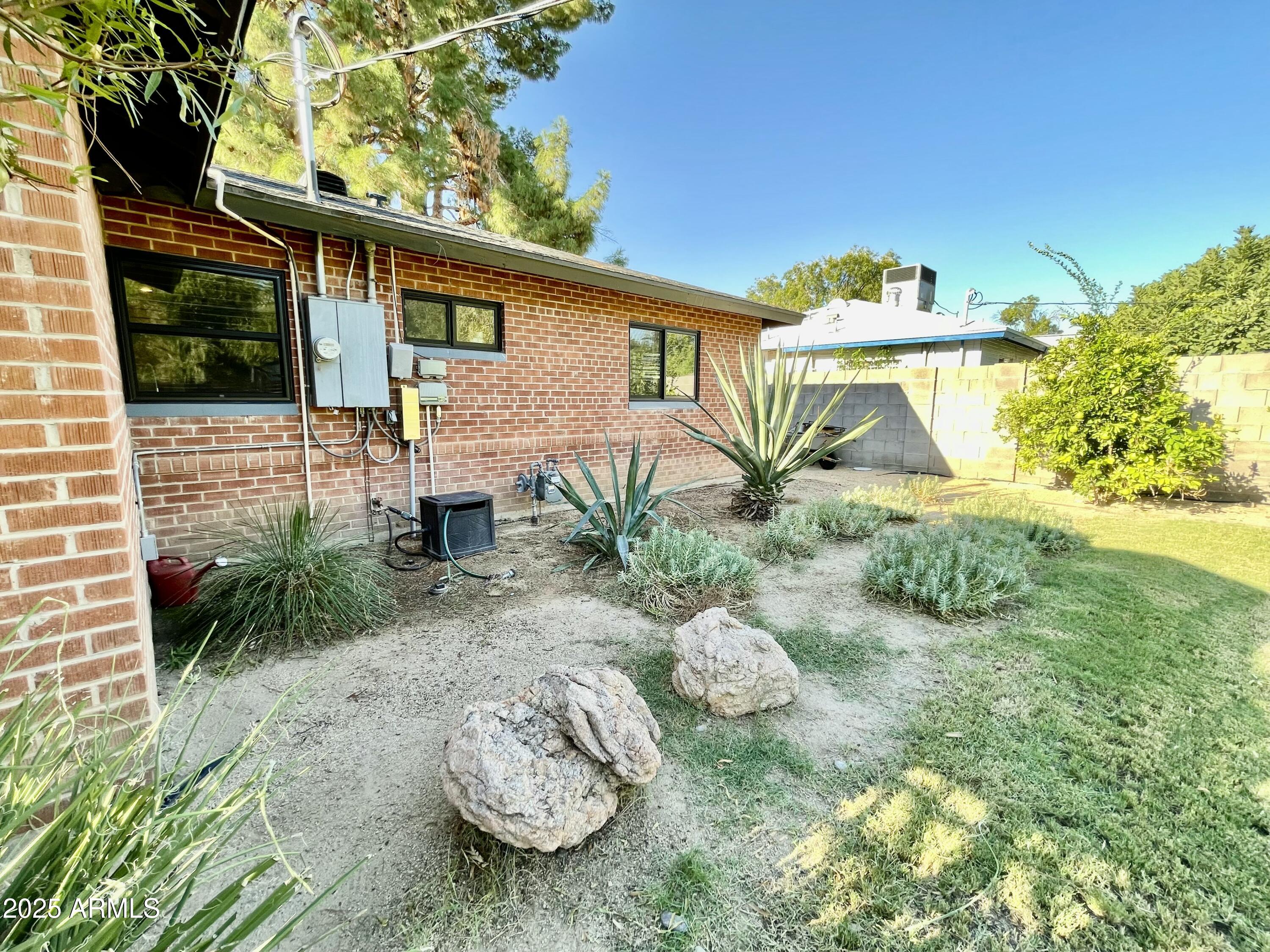 1520 West Berridge Lane Phoenix, AZ 85015 - Photo 43 of 46 a front view of a house with garden