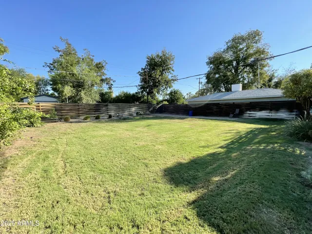 a view of a swimming pool with an outdoor space and seating area