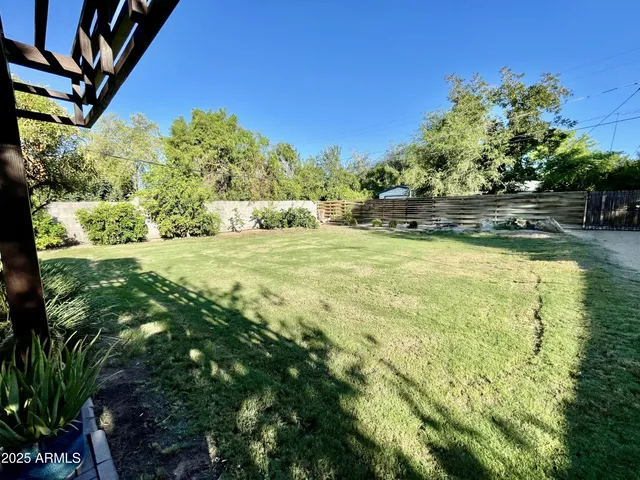 a view of yard with swimming pool and outdoor seating