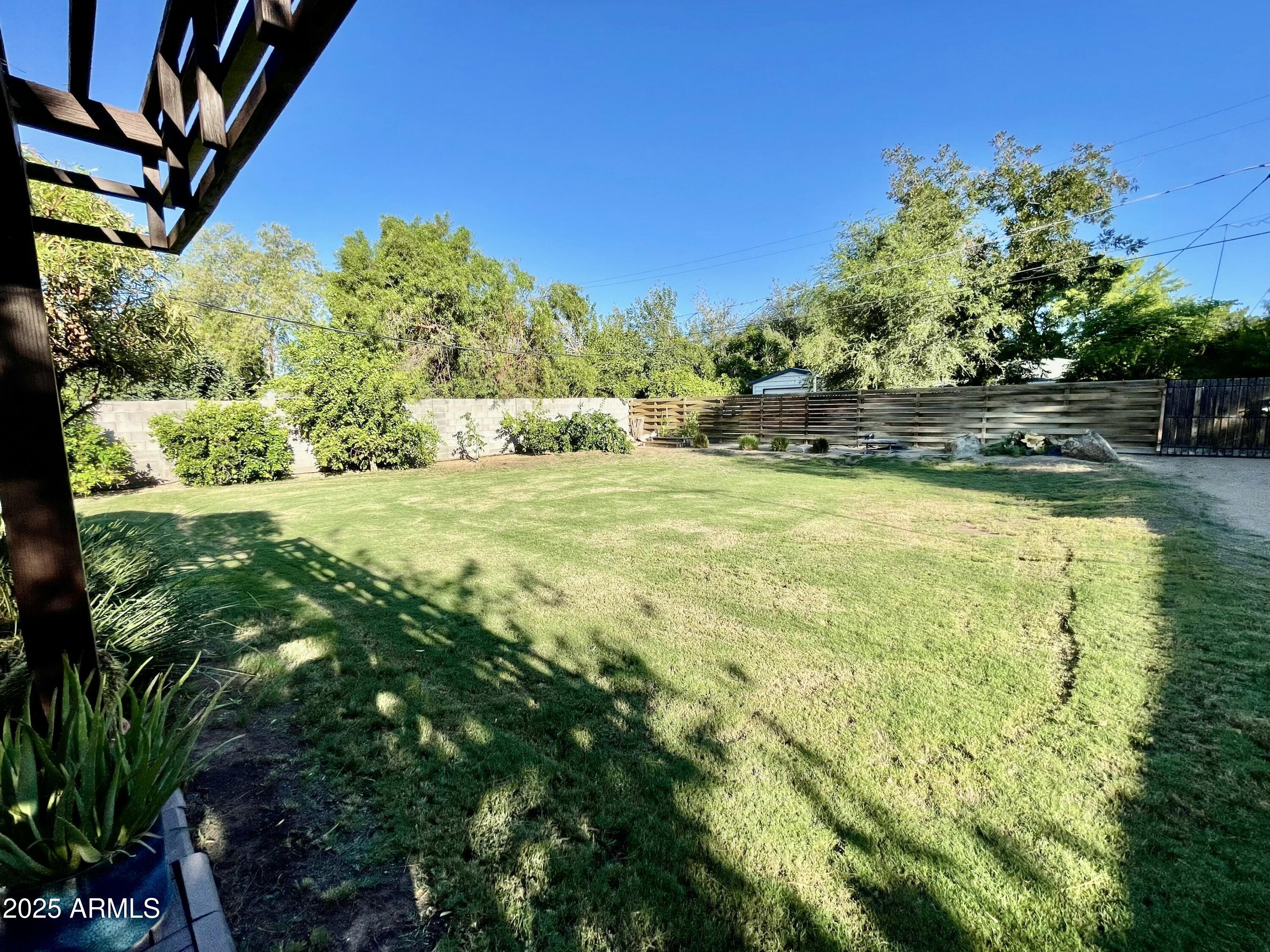 1520 West Berridge Lane Phoenix, AZ 85015 - Photo 46 of 46 a view of yard with swimming pool and outdoor seating