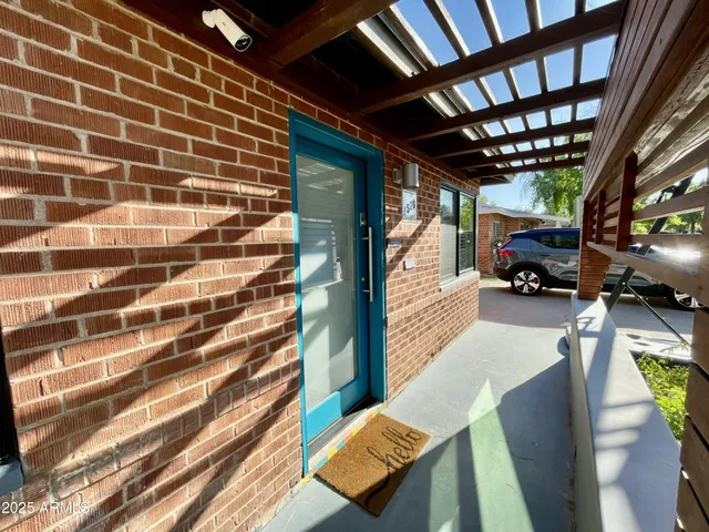 a view of living room with furniture and a chandelier