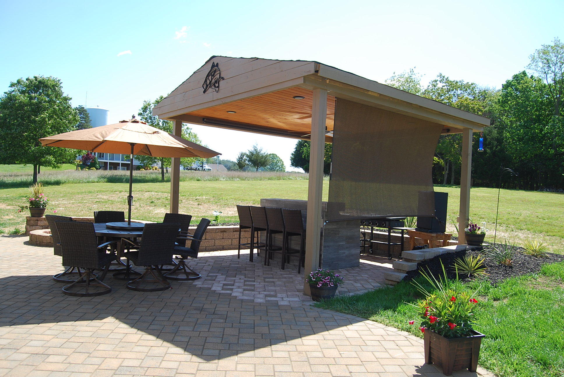 2342 Dillards Hill Road Union Hall, VA 24176 - Photo 13 of 51 a view of a patio with chairs and couches under an umbrella