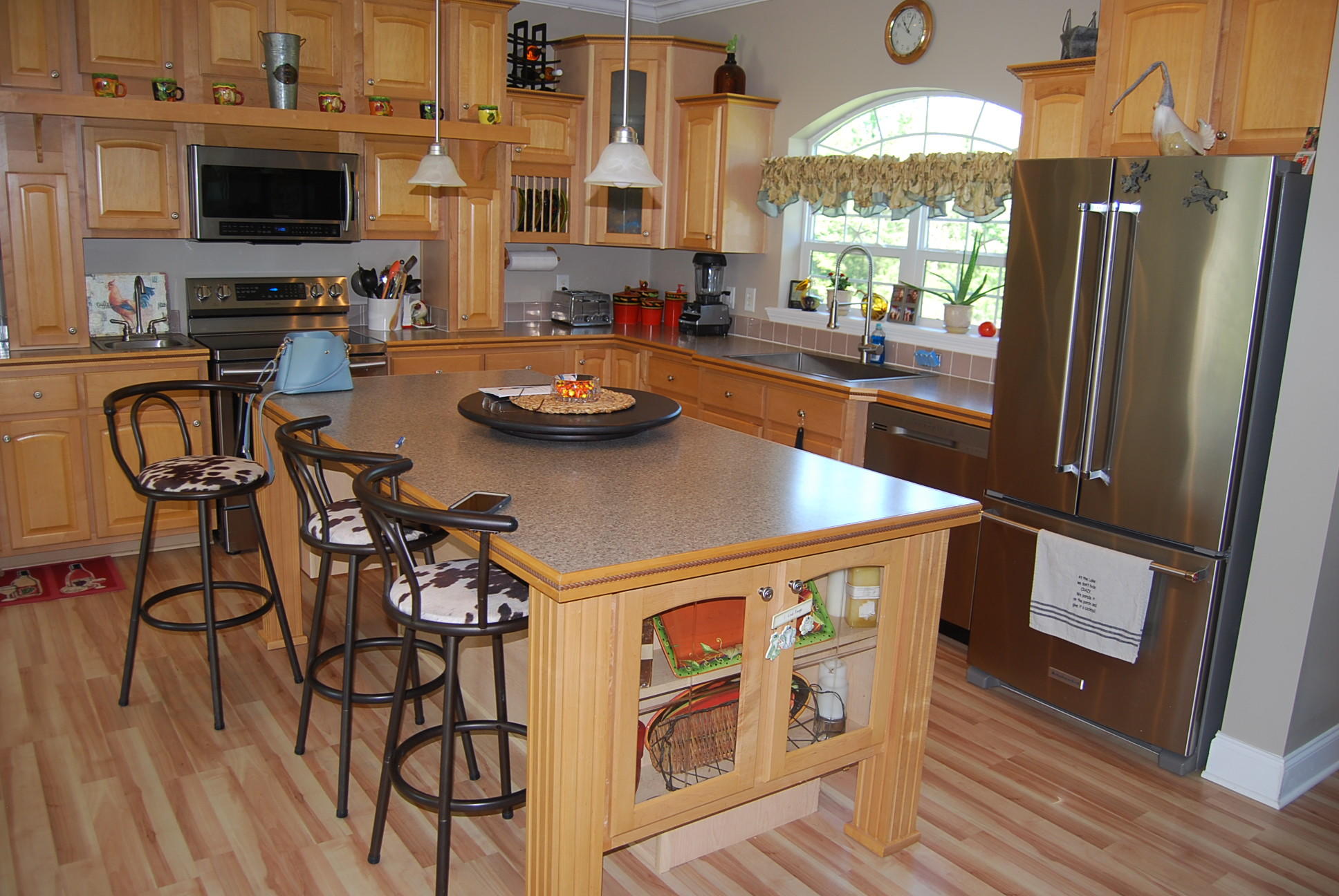 2342 Dillards Hill Road Union Hall, VA 24176 - Photo 28 of 51 a kitchen with stainless steel appliances a table chairs and a refrigerator