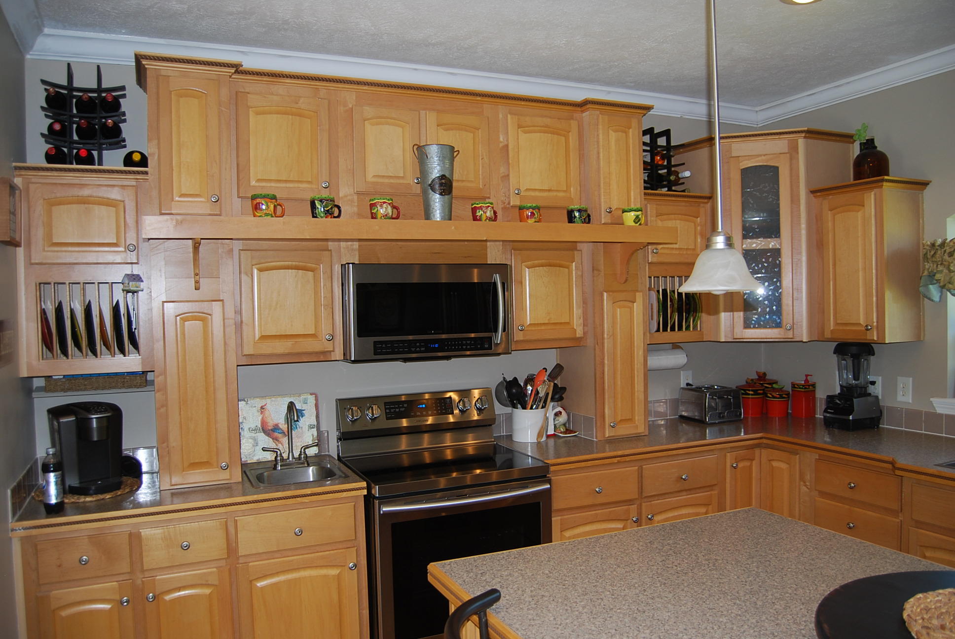 2342 Dillards Hill Road Union Hall, VA 24176 - Photo 30 of 51 a kitchen with stainless steel appliances a stove refrigerator sink and cabinets