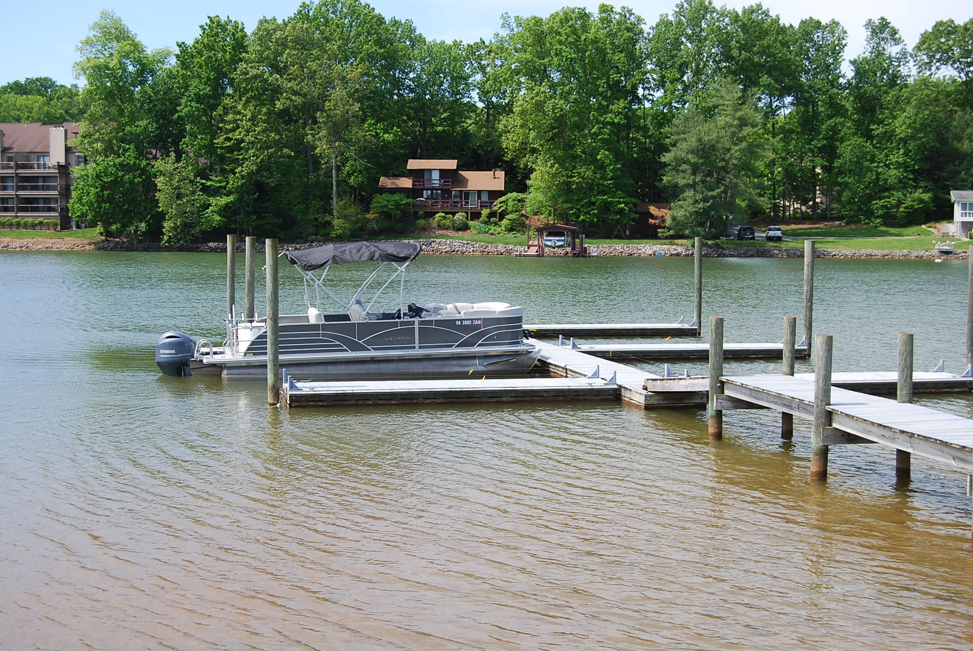 2342 Dillards Hill Road Union Hall, VA 24176 - Photo 4 of 51 a view of a lake with boats and trees in the background