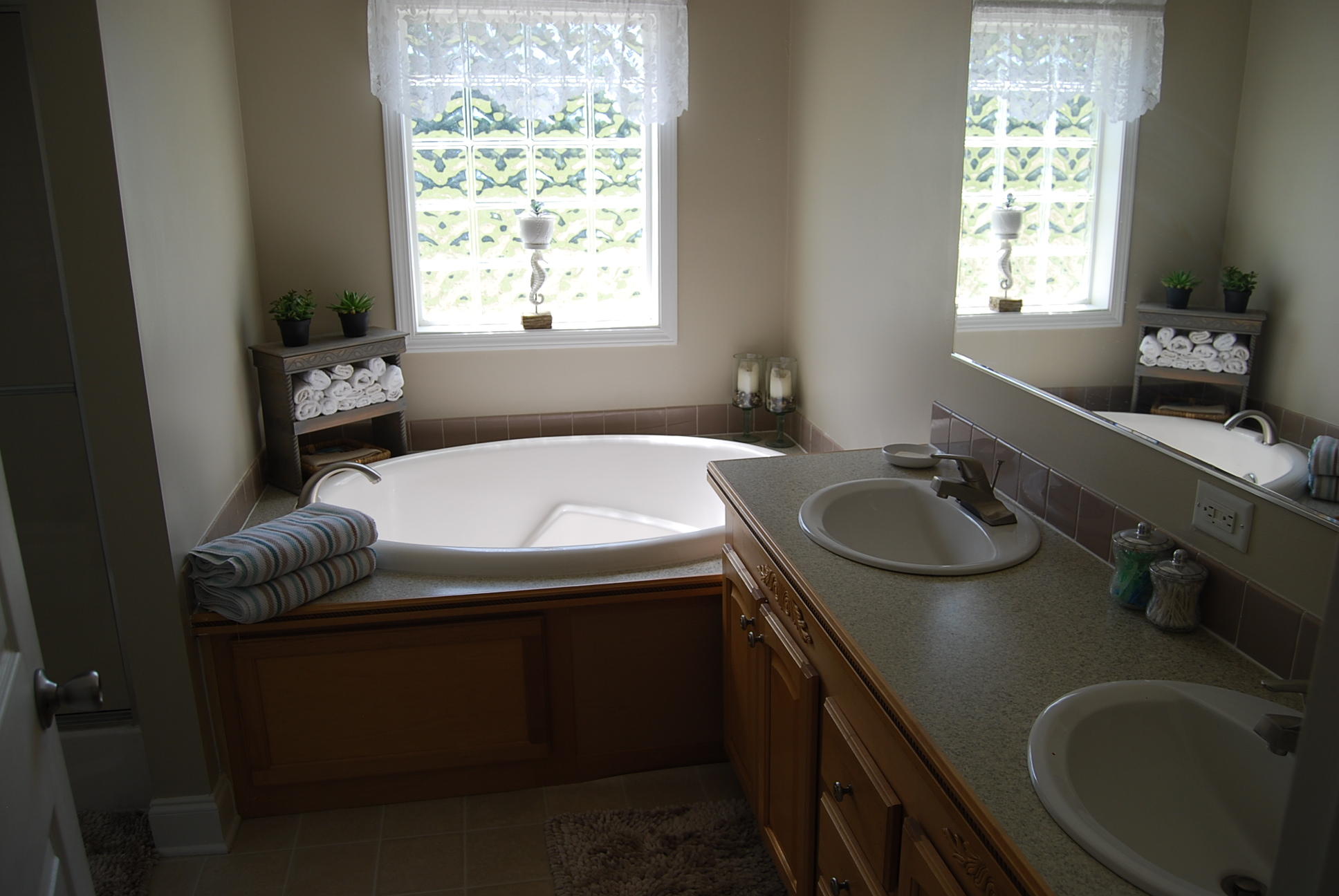 2342 Dillards Hill Road Union Hall, VA 24176 - Photo 47 of 51 a bathroom with a granite countertop sink a toilet and window