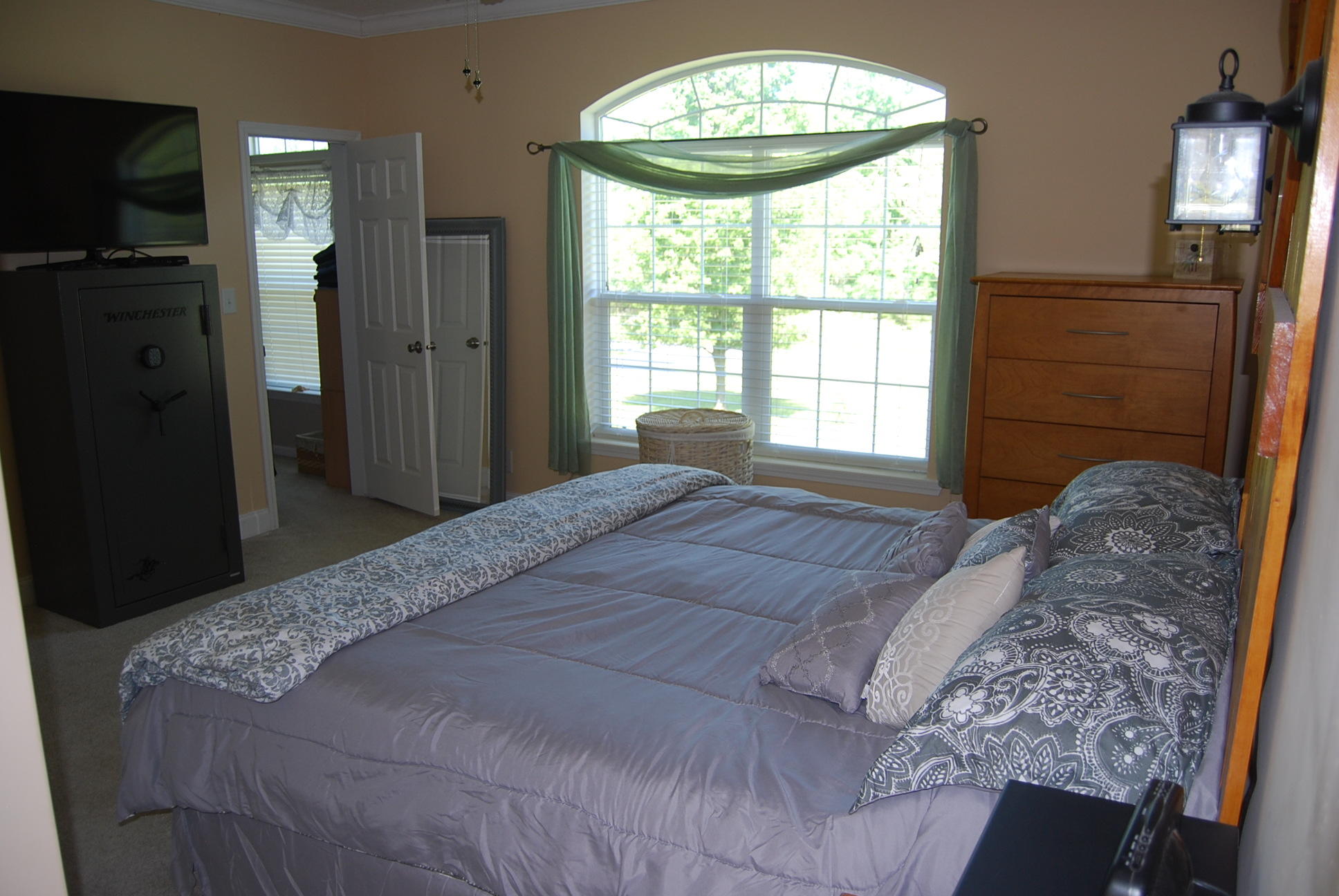 2342 Dillards Hill Road Union Hall, VA 24176 - Photo 51 of 51 a bedroom with a bed and a chandelier