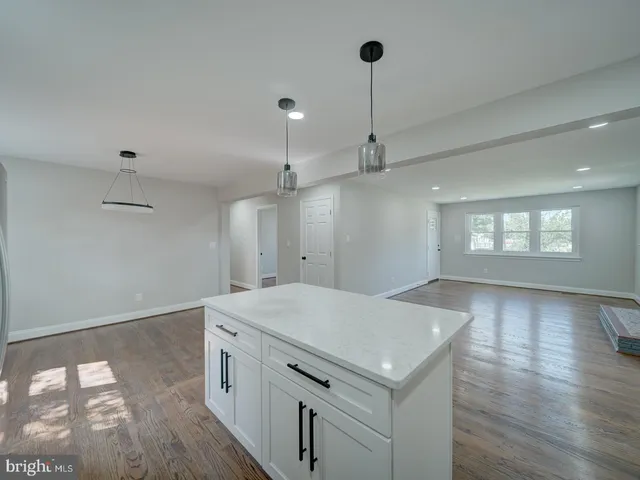 a view of kitchen with refrigerator and window