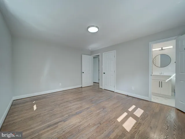a bathroom with a sink a mirror and a shower