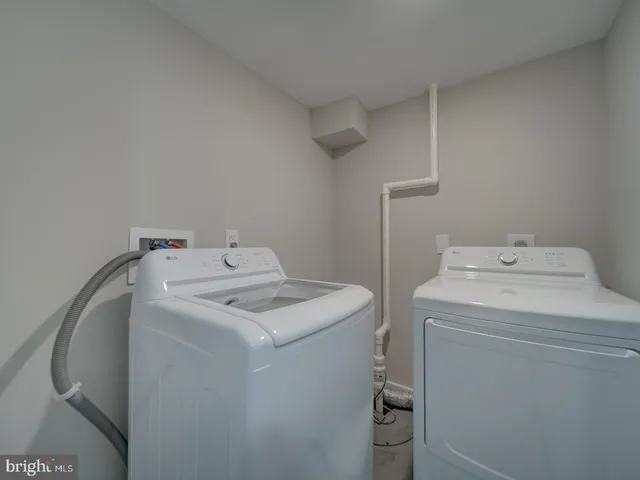 a view of an empty room and wooden floor