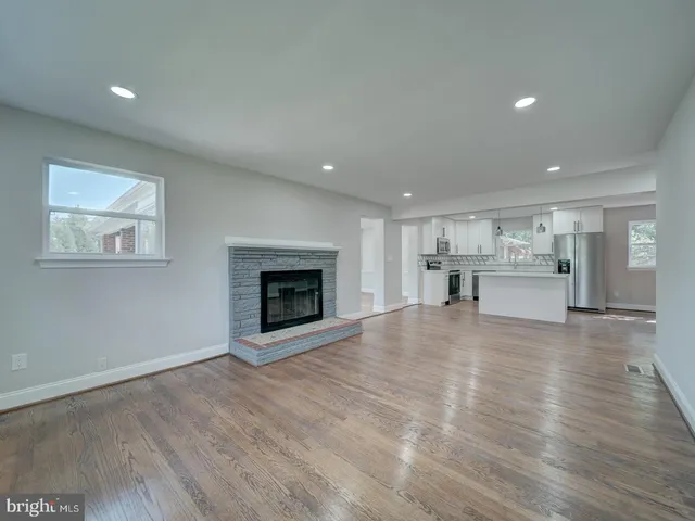 a view of kitchen and wooden floor