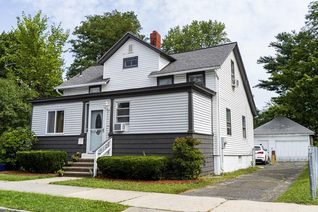 107 Ranney Street Springfield, MA 01108 - Photo 1 of 21 a front view of a house with a yard and garage