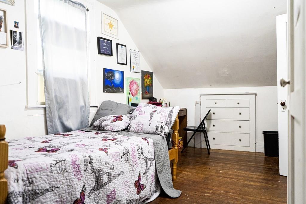 107 Ranney Street Springfield, MA 01108 - Photo 14 of 21 a bedroom with a bed and furniture