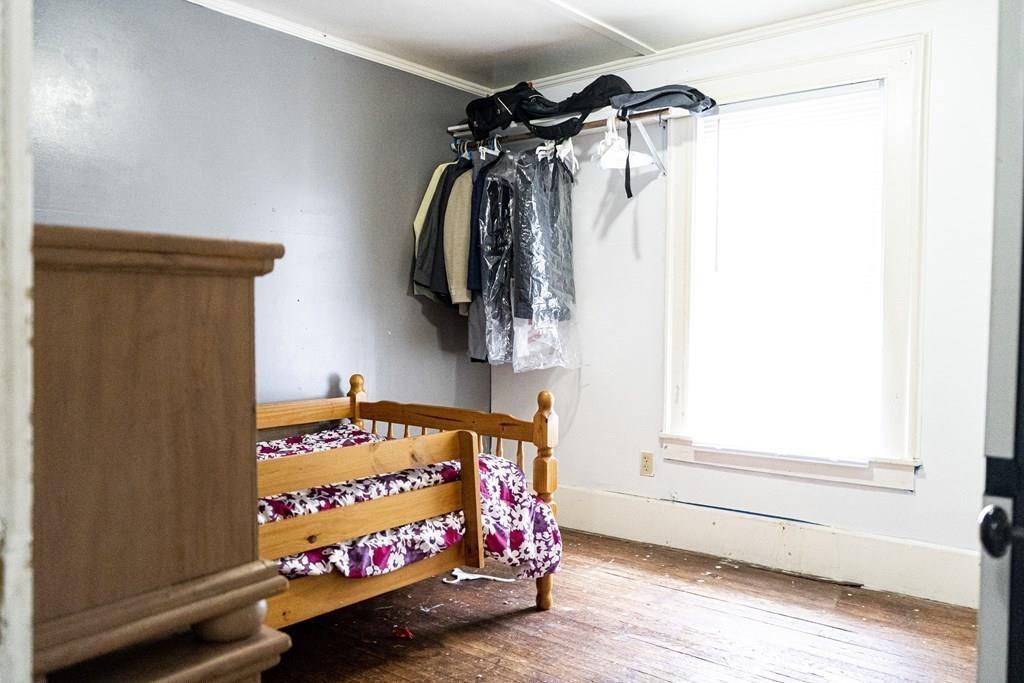 107 Ranney Street Springfield, MA 01108 - Photo 17 of 21 a view of walk in closet with clothes and shoes