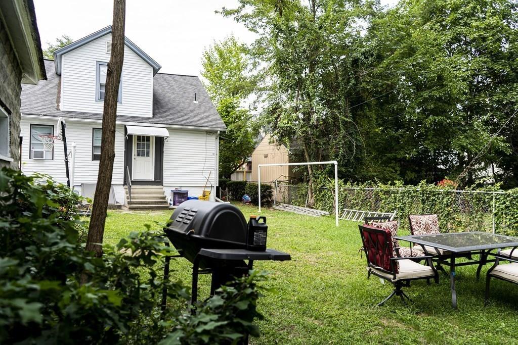 107 Ranney Street Springfield, MA 01108 - Photo 2 of 21 a swimming pool with outdoor seating and yard