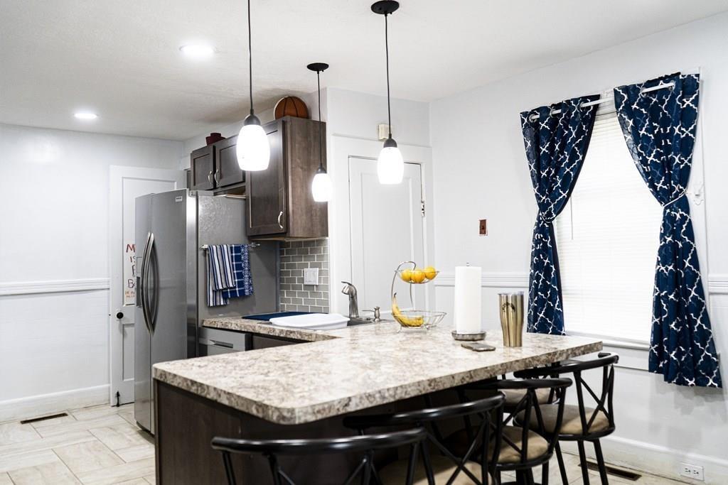 107 Ranney Street Springfield, MA 01108 - Photo 4 of 21 a kitchen that has a table and chairs in it