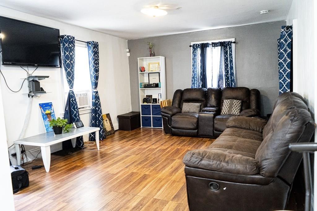 107 Ranney Street Springfield, MA 01108 - Photo 10 of 21 a living room with furniture and a flat screen tv
