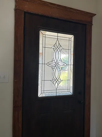 a view of a livingroom with wooden floor and a window