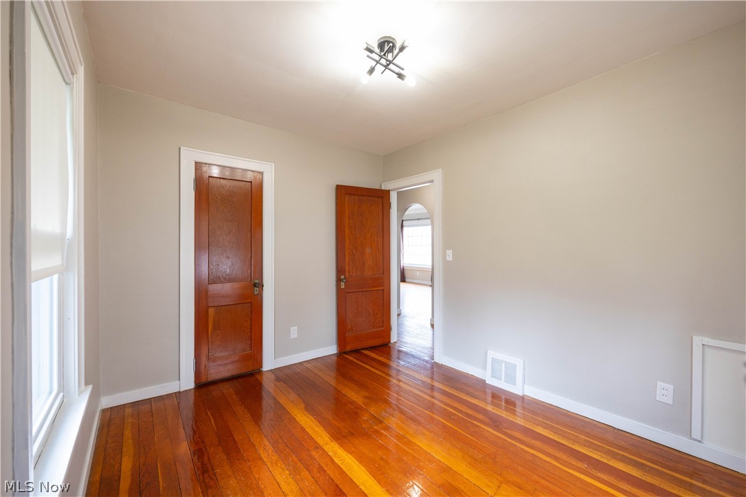 14474 Pease Road Maple Heights, OH 44137 - Photo 23 of 50 Unfurnished bedroom with dark wood-type flooring